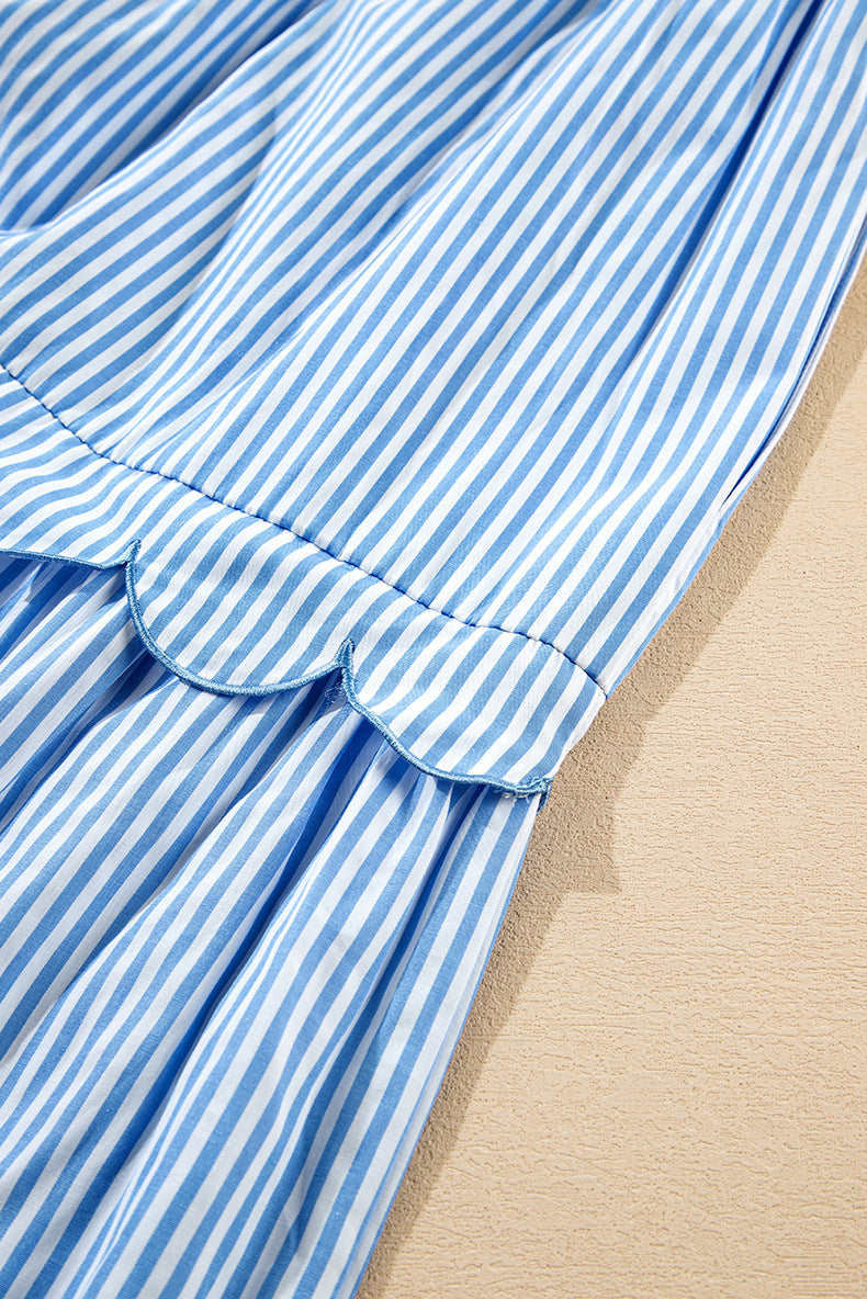 Close-up of a blue and white striped fabric on a beige background
