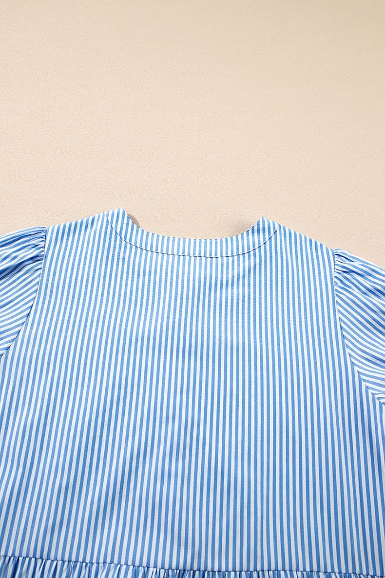 Blue and white striped shirt on a beige background