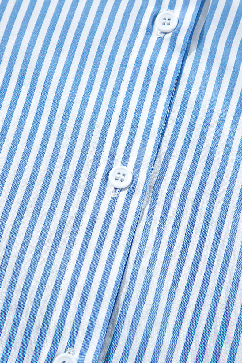 Close-up of a blue and white striped shirt with buttons.