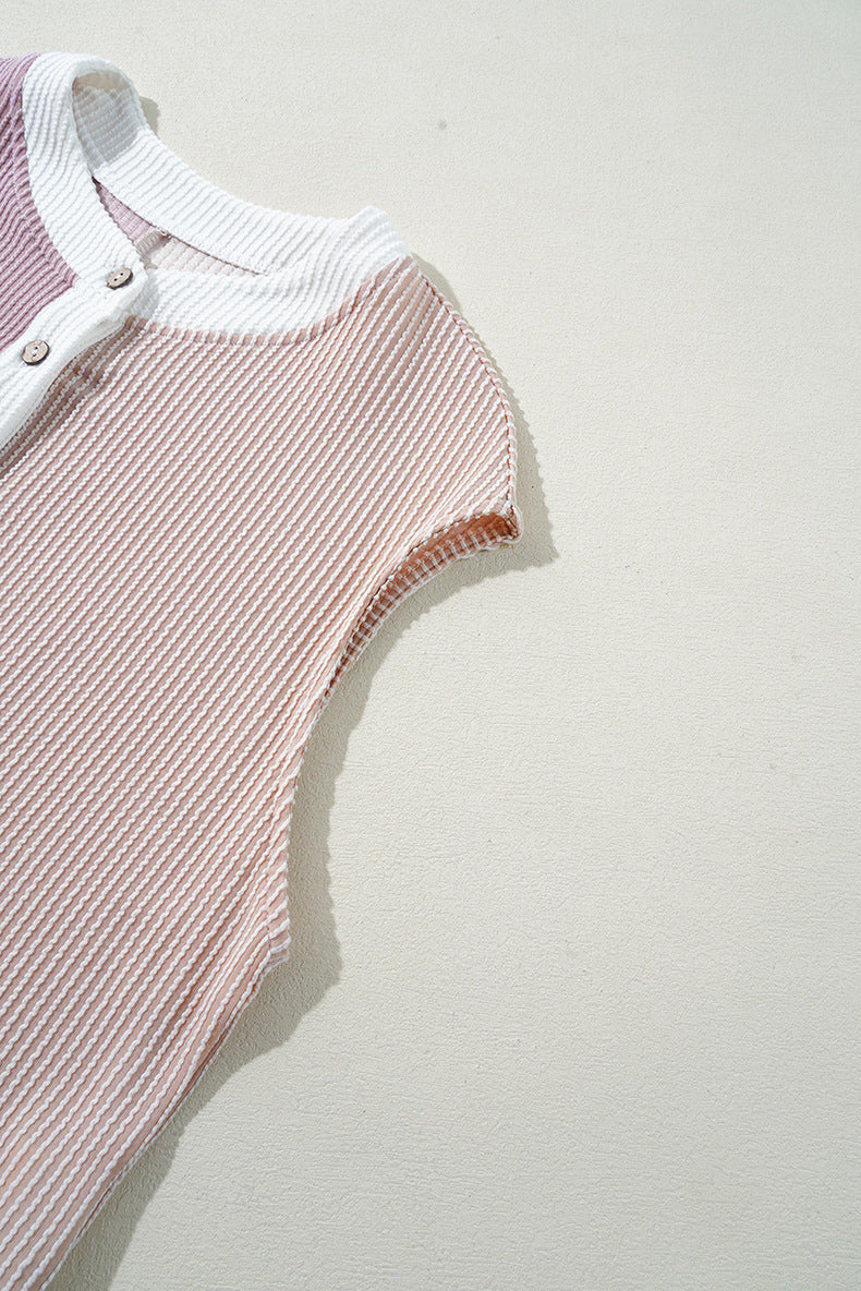 Pink ribbed sleeveless top with white collar on a light gray background
