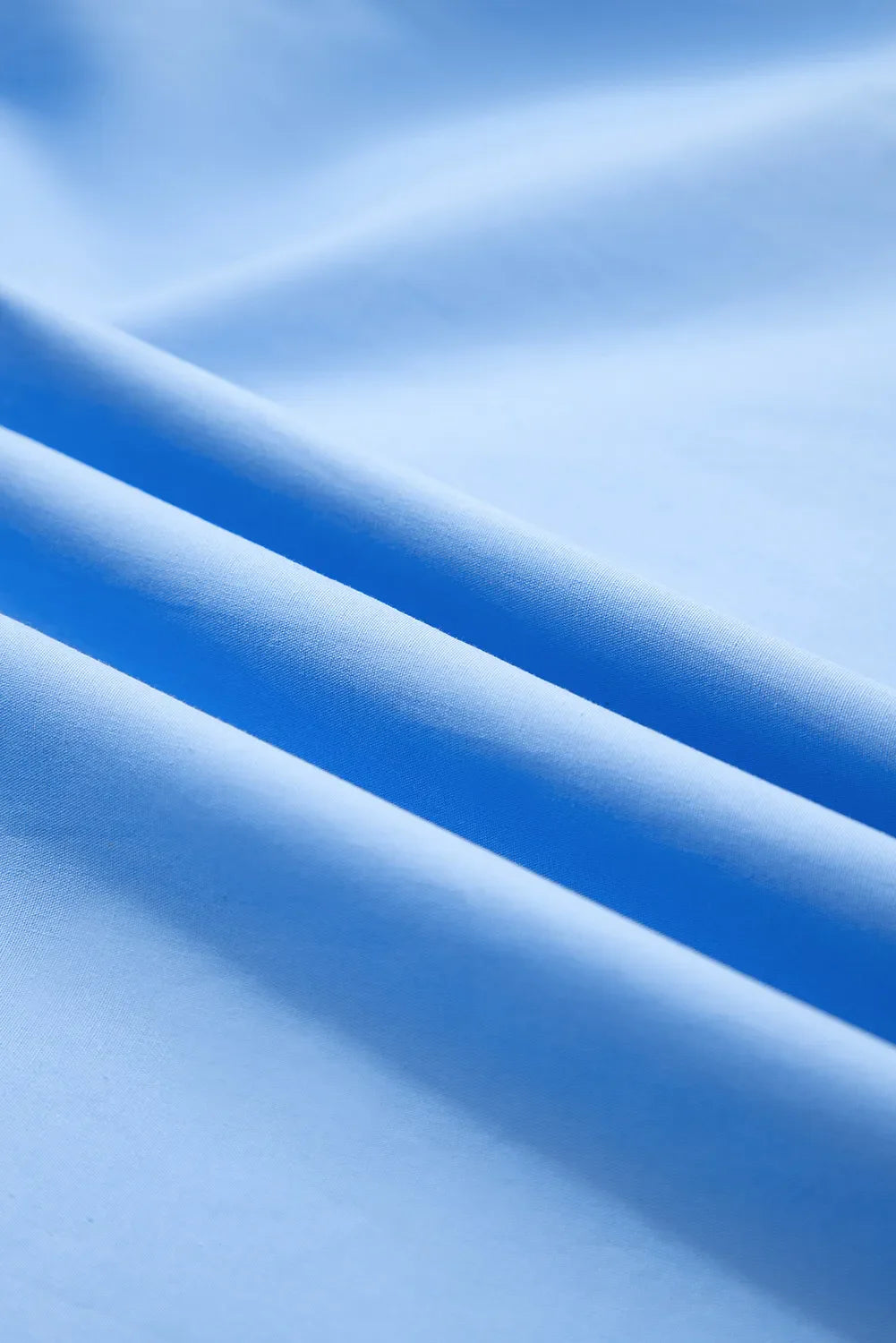 Close-up of blue fabric with folds