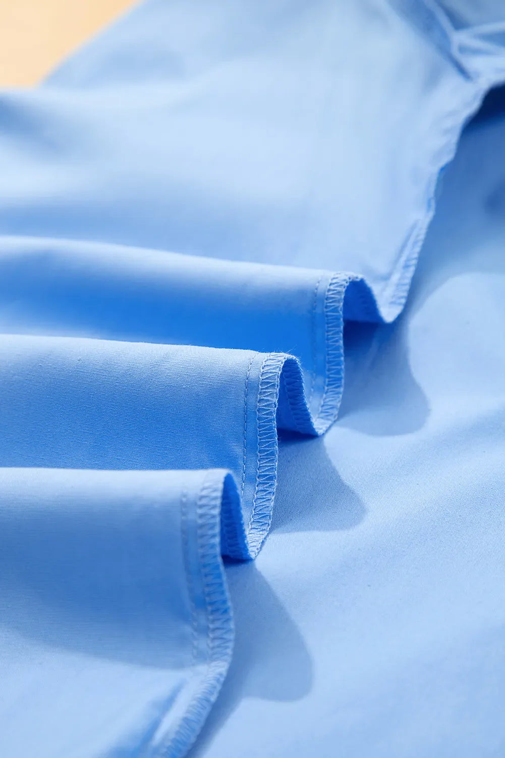 Close-up of light blue fabric with a soft texture