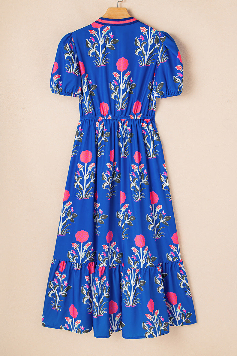 Blue dress with floral pattern on a beige background