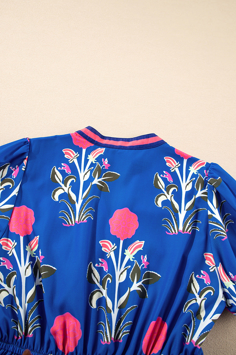 Blue dress with floral patterns on a beige background