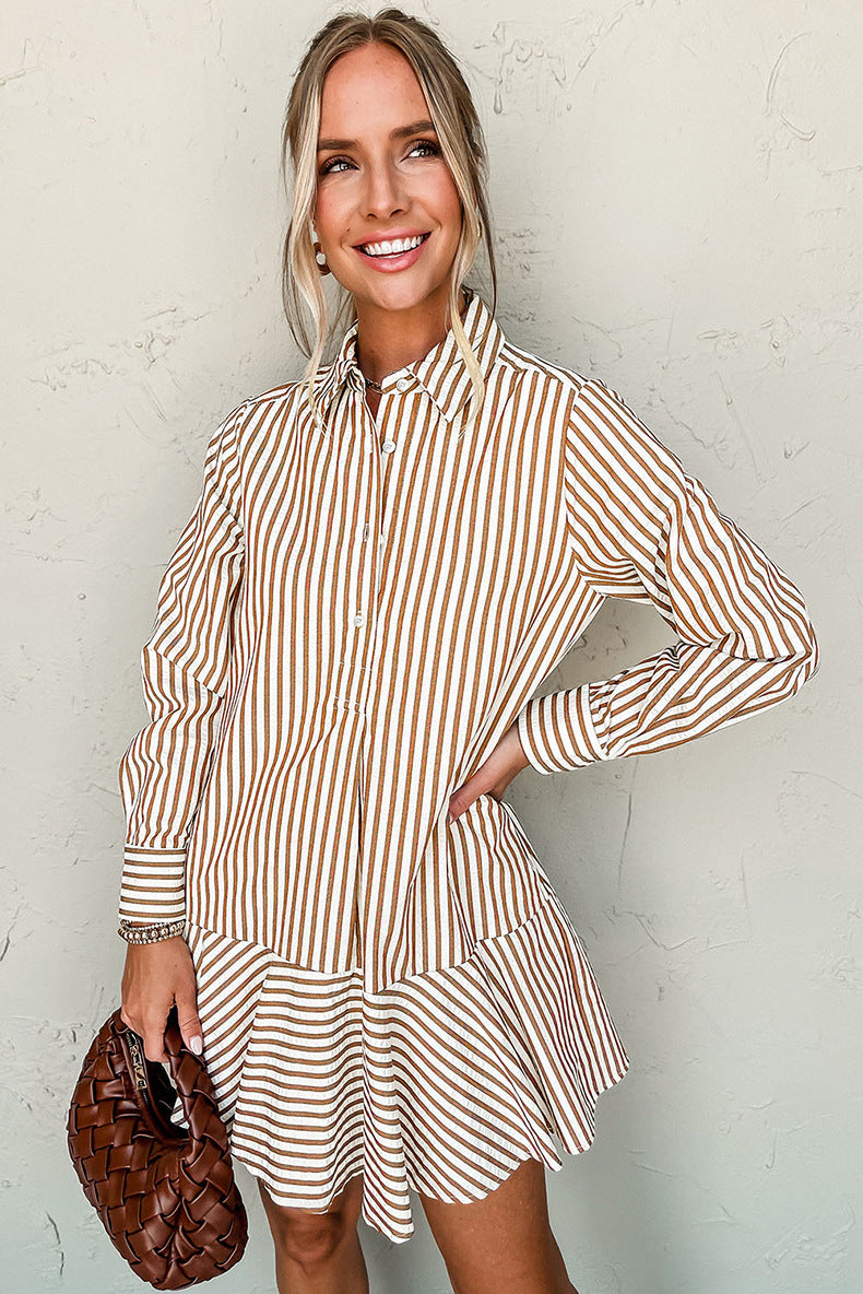 Woman wearing a striped dress with a textured wall background