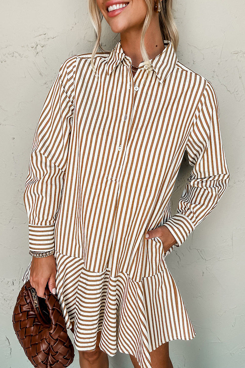 Woman wearing a brown and white striped dress against a plain background