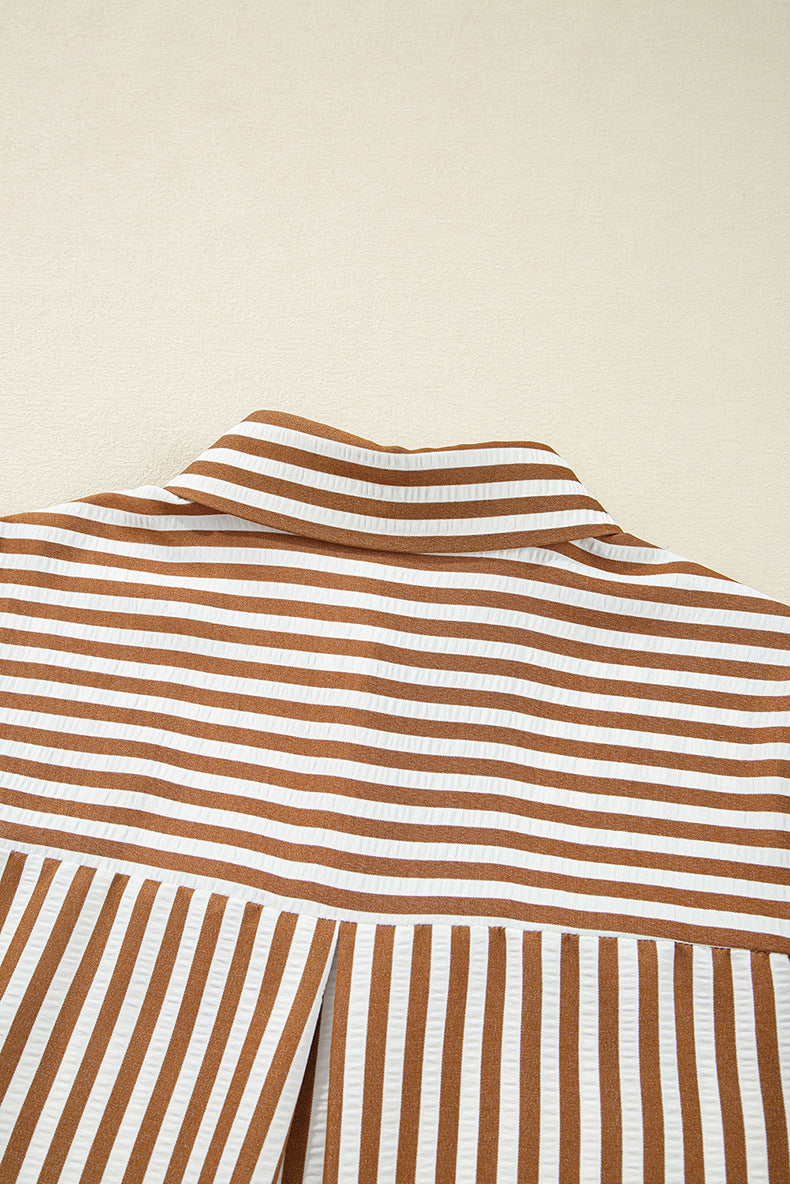 Close-up of a brown and white striped fabric on a beige background