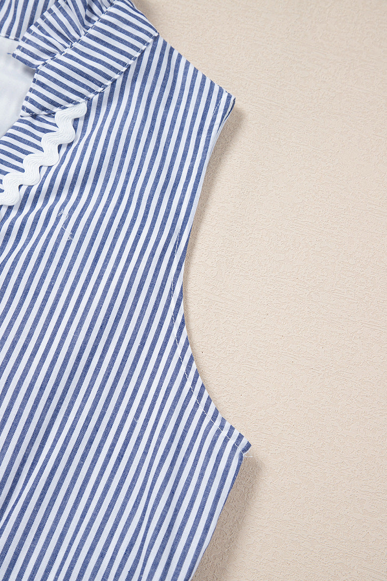 Blue and white striped dress with ruffled details on a beige background